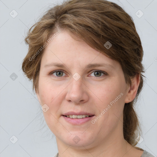 Joyful white young-adult female with medium  brown hair and blue eyes