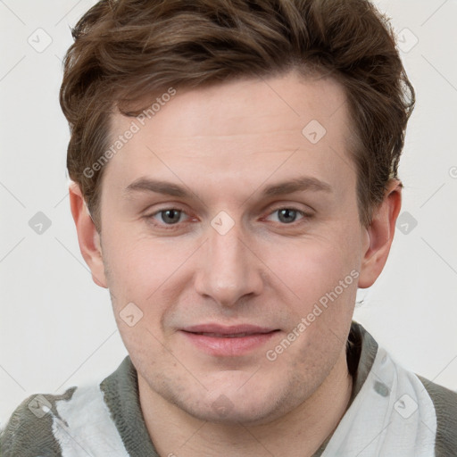 Joyful white adult male with short  brown hair and grey eyes