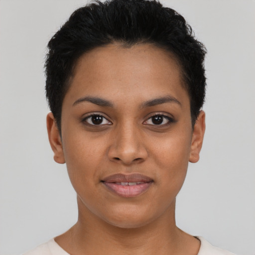 Joyful latino young-adult female with short  black hair and brown eyes
