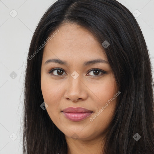 Joyful latino young-adult female with long  brown hair and brown eyes