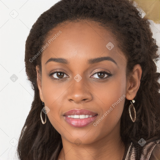 Joyful black young-adult female with long  brown hair and brown eyes