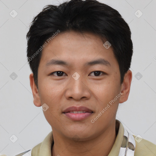 Joyful asian young-adult male with short  brown hair and brown eyes