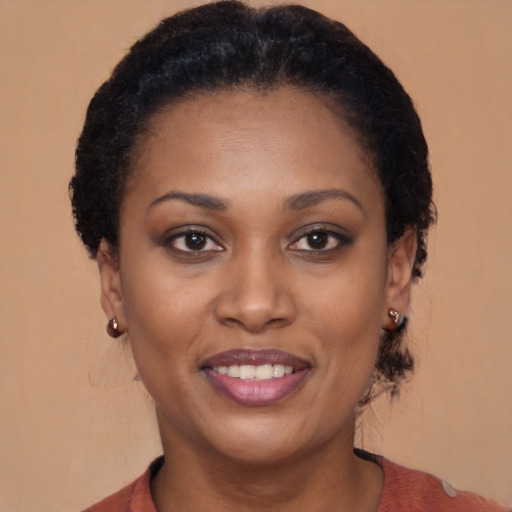 Joyful black young-adult female with short  brown hair and brown eyes