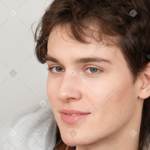 Neutral white young-adult male with medium  brown hair and grey eyes