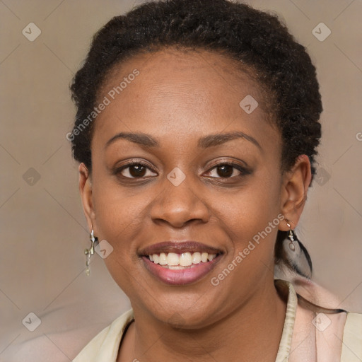 Joyful black young-adult female with short  brown hair and brown eyes