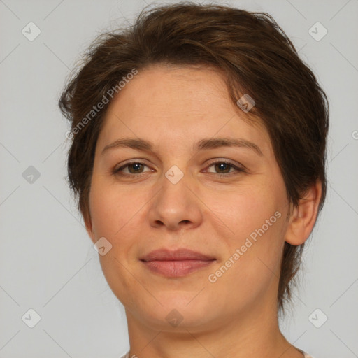 Joyful white adult female with short  brown hair and brown eyes