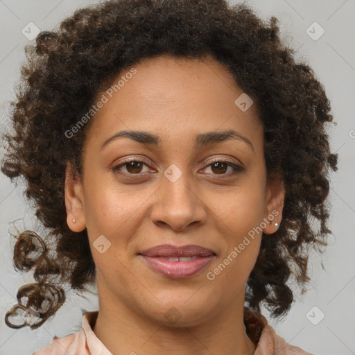 Joyful black adult female with medium  brown hair and brown eyes