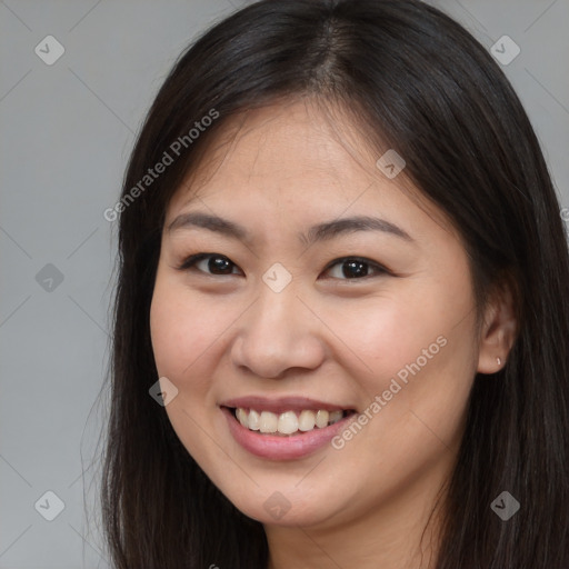 Joyful asian young-adult female with long  brown hair and brown eyes