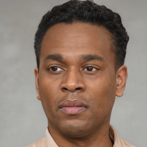 Neutral black young-adult male with short  black hair and brown eyes