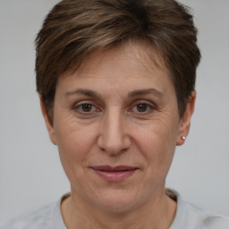 Joyful white adult female with short  brown hair and brown eyes