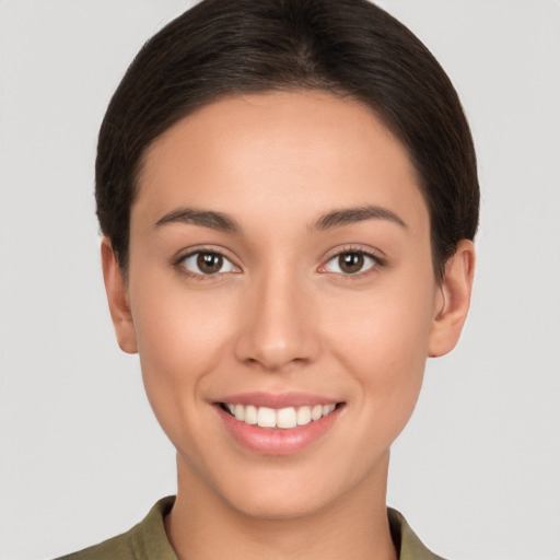 Joyful white young-adult female with short  brown hair and brown eyes