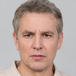 Neutral white adult male with short  brown hair and grey eyes