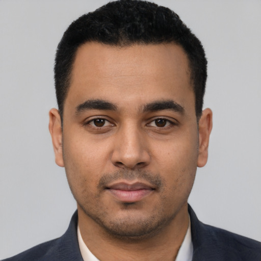 Neutral latino young-adult male with short  black hair and brown eyes
