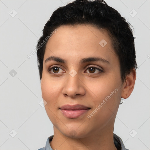 Joyful latino young-adult female with short  black hair and brown eyes