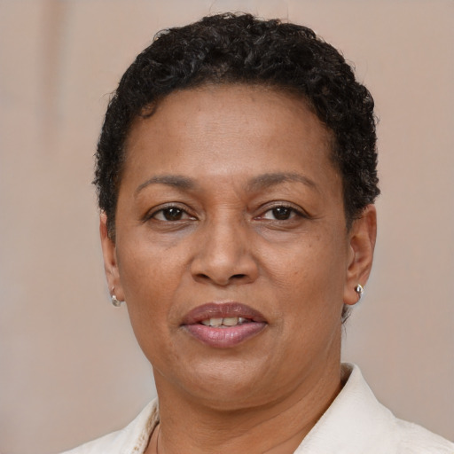 Joyful latino adult female with short  brown hair and brown eyes