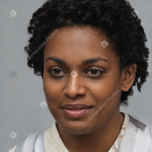 Joyful black young-adult female with short  black hair and brown eyes