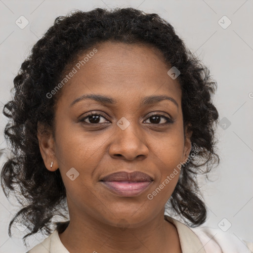 Joyful black adult female with medium  brown hair and brown eyes