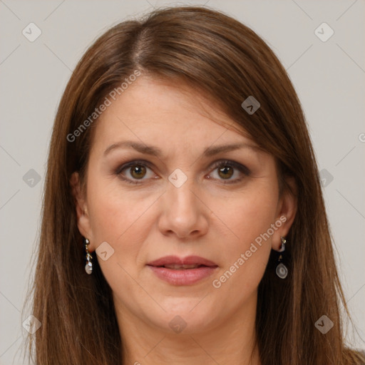 Joyful white adult female with long  brown hair and brown eyes