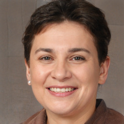 Joyful white adult female with short  brown hair and brown eyes