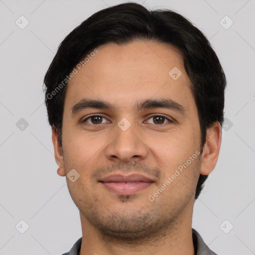 Joyful latino young-adult male with short  black hair and brown eyes