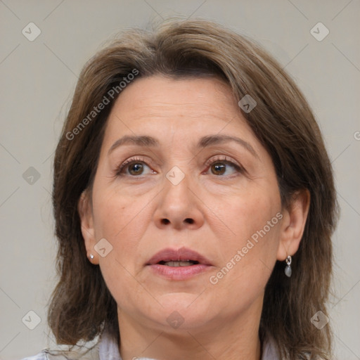 Joyful white adult female with medium  brown hair and brown eyes