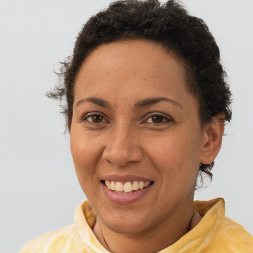 Joyful latino young-adult female with short  brown hair and brown eyes