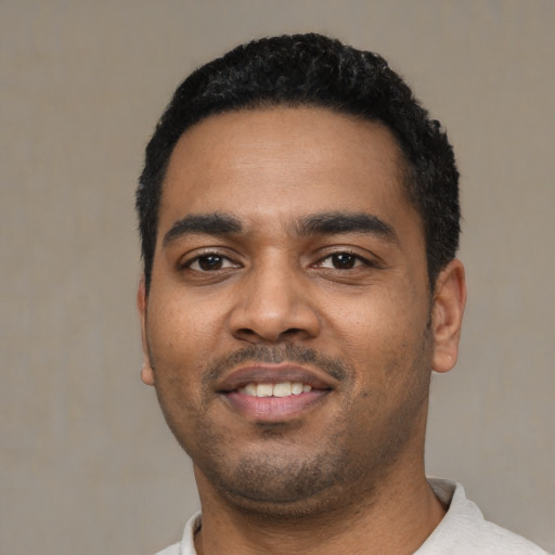 Neutral black young-adult male with short  black hair and brown eyes