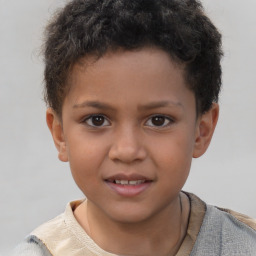 Joyful white child male with short  brown hair and brown eyes