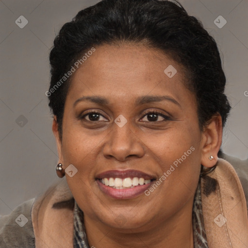 Joyful latino adult female with short  brown hair and brown eyes