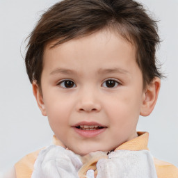 Joyful white child male with short  brown hair and brown eyes