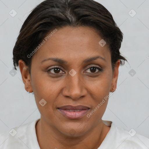Joyful black adult female with short  brown hair and brown eyes