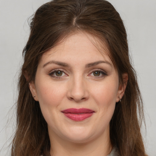 Joyful white young-adult female with long  brown hair and grey eyes