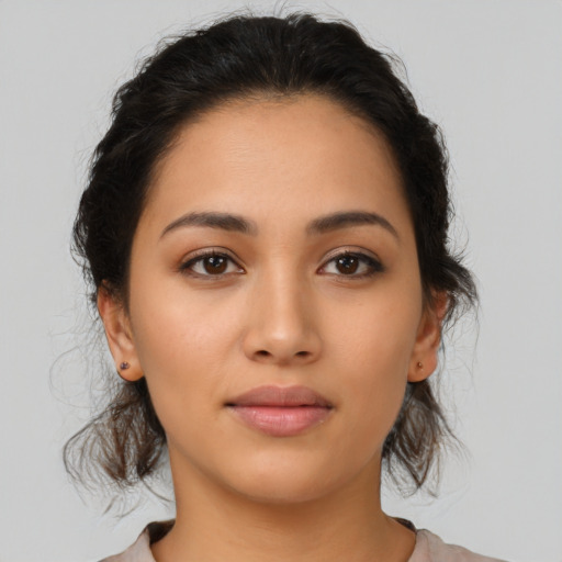 Neutral latino young-adult female with medium  brown hair and brown eyes