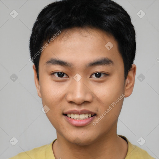 Joyful asian young-adult male with short  black hair and brown eyes