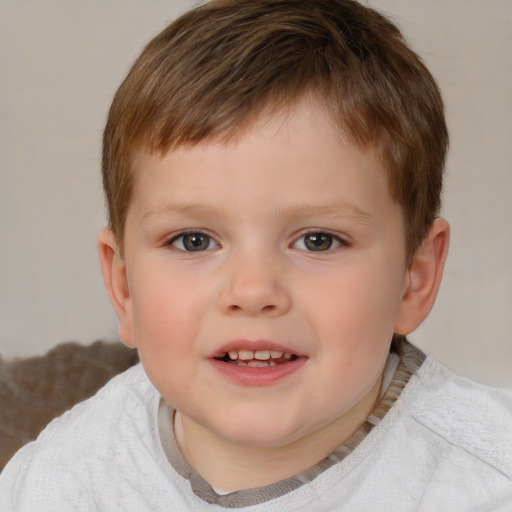 Joyful white child male with short  brown hair and brown eyes