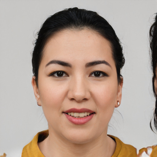 Joyful white young-adult female with medium  brown hair and brown eyes