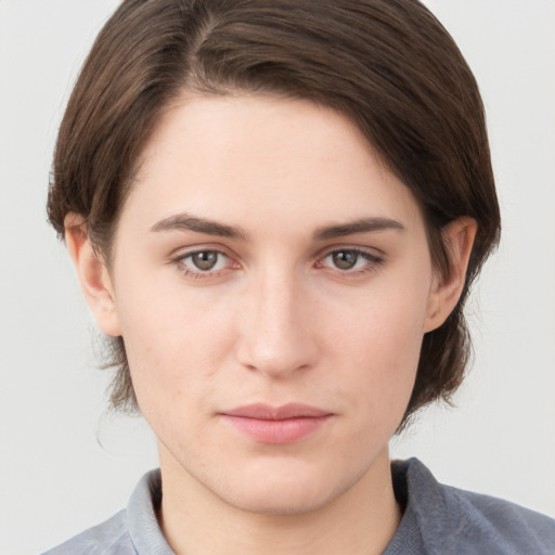 Neutral white young-adult female with short  brown hair and brown eyes