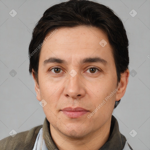 Joyful white adult male with short  brown hair and brown eyes