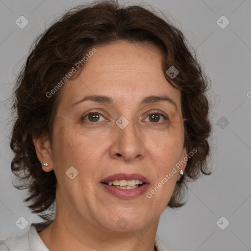 Joyful white adult female with medium  brown hair and blue eyes