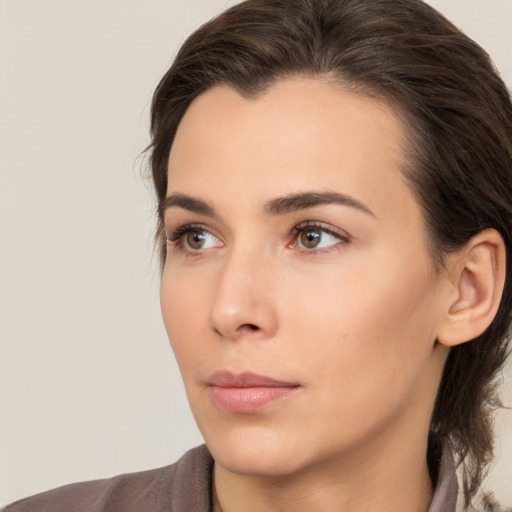 Neutral white young-adult female with medium  brown hair and brown eyes