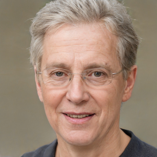 Joyful white middle-aged male with short  gray hair and grey eyes