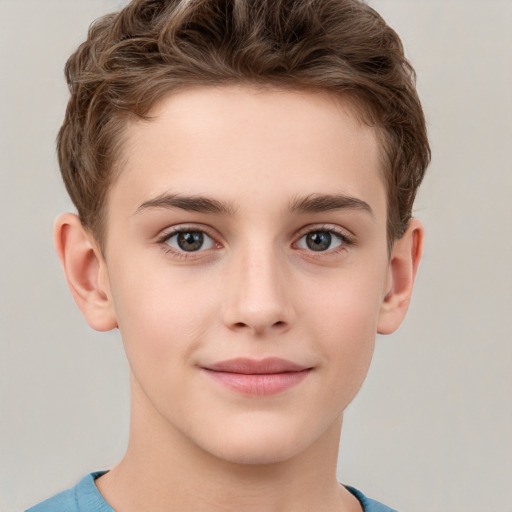 Joyful white child male with short  brown hair and grey eyes