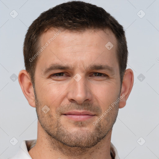 Joyful white adult male with short  brown hair and brown eyes