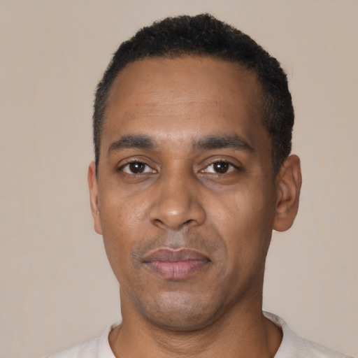 Neutral black adult male with short  black hair and brown eyes