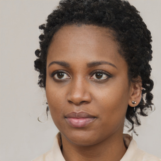 Neutral black young-adult female with medium  black hair and brown eyes