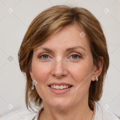 Joyful white adult female with medium  brown hair and blue eyes