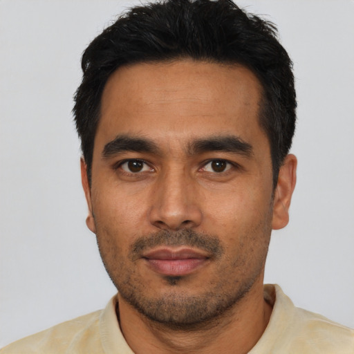 Neutral latino young-adult male with short  black hair and brown eyes