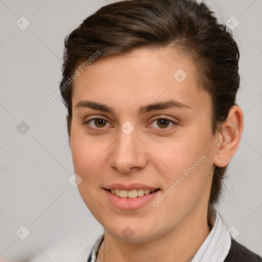 Joyful white young-adult female with short  brown hair and brown eyes