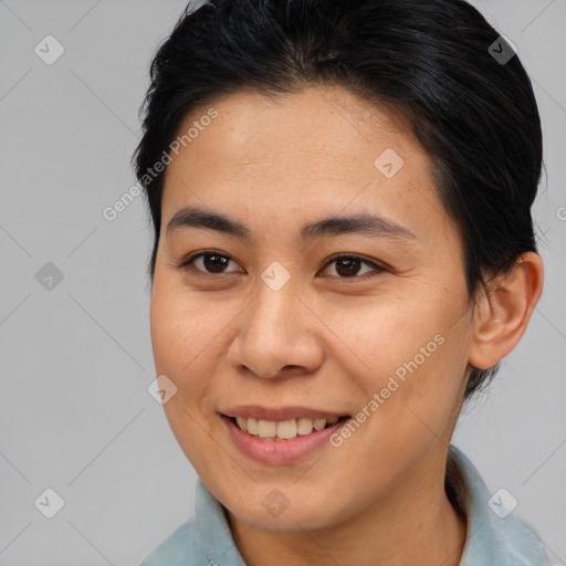 Joyful asian young-adult female with medium  brown hair and brown eyes