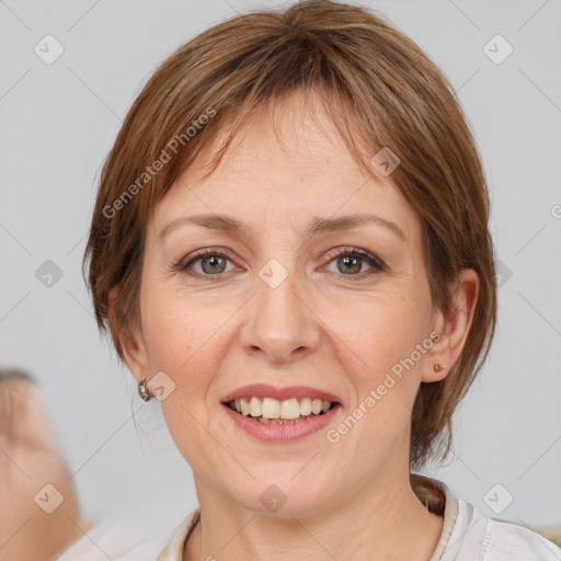 Joyful white adult female with medium  brown hair and brown eyes